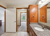 Thumbnail 18 of 58 - a bathroom with a sink and a mirror