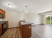 Thumbnail 8 of 58 - an empty kitchen and living room with a large window