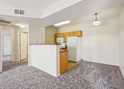Thumbnail 11 of 36 - A kitchen area with a white counter and a microwave.