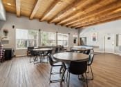 Thumbnail 18 of 39 - a dining room with tables and chairs and a pool table