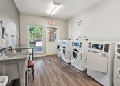 Thumbnail 34 of 39 - the preserve at ballantyne commons laundry room with washes and dryers