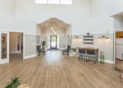 Thumbnail 5 of 18 - a living room with a dining room and a kitchen