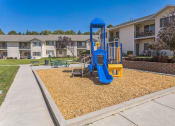 Thumbnail 10 of 18 - our playground is in front of our apartments with a blue swing set