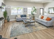 Thumbnail 1 of 18 - a living room with two couches and a coffee table