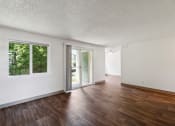 Thumbnail 20 of 32 - the living room and dining room of an apartment