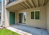 Thumbnail 28 of 32 - the screened in porch of a manufactured home with a sliding glass door