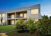 Thumbnail 27 of 32 - the exterior of a house with a yard and trees