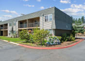 Thumbnail 24 of 32 - the front of an apartment building with a roundabout in front of it