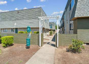 Thumbnail 29 of 32 - a walkway between two buildings with a blue fire hydrant