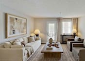 Thumbnail 5 of 13 - A living room with a couch, chairs, and a coffee table at Arbors at Hickory Creek Apartments , University Park, 60484