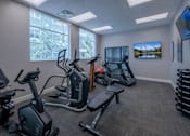 Thumbnail 17 of 26 - Fitness center with cardio and weight equipment at The Beckstead Apartments, Utah, 84095