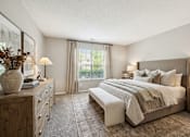 Thumbnail 24 of 26 - Spacious bedroom with neutral tones and large window at Delta Crossing Apartments, Charlotte, 28212
