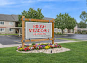 Thumbnail 1 of 38 - Monument Sign at Brush Meadows I & II Apartments, Billings, MT