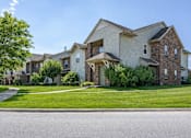 Thumbnail 1 of 13 - A row of houses with a tree in front of the first one. at Arbors at Hickory Creek Apartments , Illinois, 60484