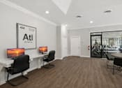 Thumbnail 8 of 15 - A modern office space with a white desk and two chairs.