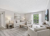 Thumbnail 7 of 19 - A well-lit, spacious living room with a large window and a view of the outdoors.