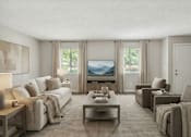 Thumbnail 10 of 15 - A living room with a large couch, a coffee table, and a television.