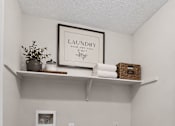 Thumbnail 13 of 14 - Laundry room with a shelf and a basket.