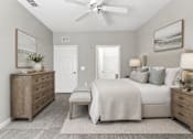 Thumbnail 21 of 24 - A bedroom with a bed, dresser, and nightstand.