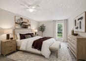 Thumbnail 16 of 19 - A bedroom with a bed, nightstands, and a ceiling fan.