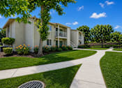 Thumbnail 9 of 12 - A sunny day at a well-kept apartment complex.