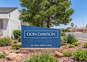 Thumbnail 1 of 11 - A blue sign that says "Don Dawson Apartments" in front of a building.