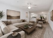Thumbnail 15 of 25 - A living room with a large couch and a coffee table.