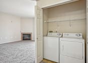 Thumbnail 15 of 36 - A laundry room with a washer and dryer.