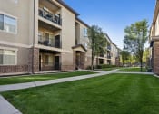 Thumbnail 9 of 31 - our apartments have a spacious courtyard with green grass and trees