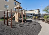 Thumbnail 20 of 31 - an empty playground in front of a building