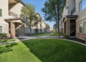 Thumbnail 15 of 31 - our apartments have a spacious courtyard with grass and trees