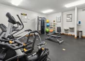 Thumbnail 22 of 31 - the gym with treadmills and other equipment at the enclave at woodbridge apartments