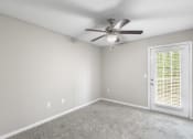 Thumbnail 12 of 29 - an empty room with a ceiling fan and a window