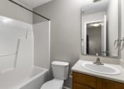 Thumbnail 17 of 29 - an empty bathroom with a sink toilet and shower