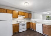 Thumbnail 2 of 29 - a kitchen with white appliances and wooden cabinets