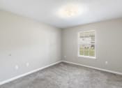 Thumbnail 11 of 29 - an empty room with carpet and a window