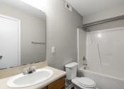 Thumbnail 13 of 29 - an empty bathroom with a sink toilet and shower