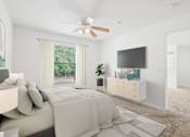 Thumbnail 4 of 20 - A bedroom with a large bed and a flat screen TV mounted on the wall.