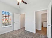 Thumbnail 9 of 36 - A room with a ceiling fan and a window with blinds.