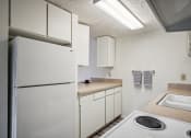 Thumbnail 13 of 35 - a kitchen with white appliances and a white refrigerator
