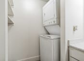 Thumbnail 14 of 35 - an empty laundry room with a washer and dryer in it