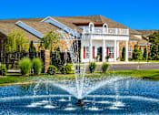 Thumbnail 1 of 23 - A house with a water fountain in front of it.