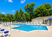 Thumbnail 10 of 21 - Swimming pool with lounge chairs at Northview Park Apartments, Sterling Heights, Michigan