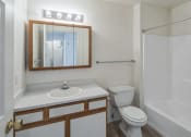 Thumbnail 21 of 34 - a bathroom with a sink toilet and a shower