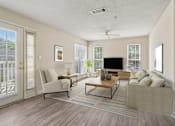 Thumbnail 2 of 17 - A living room with a couch, chair, and television.