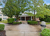 Thumbnail 20 of 22 - A building with a green lawn in front.