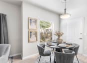 Thumbnail 5 of 30 - a dining room with a table and chairs
