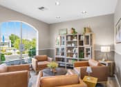 Thumbnail 22 of 30 - a living room with brown leather furniture and a large window