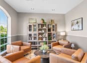 Thumbnail 30 of 30 - a living room with brown leather furniture and a bookshelf