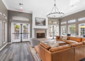 Thumbnail 25 of 30 - a living room with leather couches and a fireplace